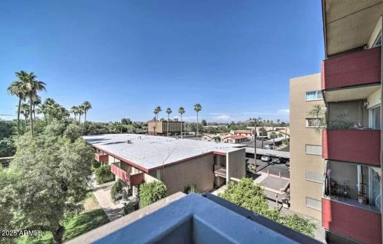 353 East Thomas Road, Unit C404 Phoenix, AZ 85004 - Photo 2 of 18 a view of a city from a terrace