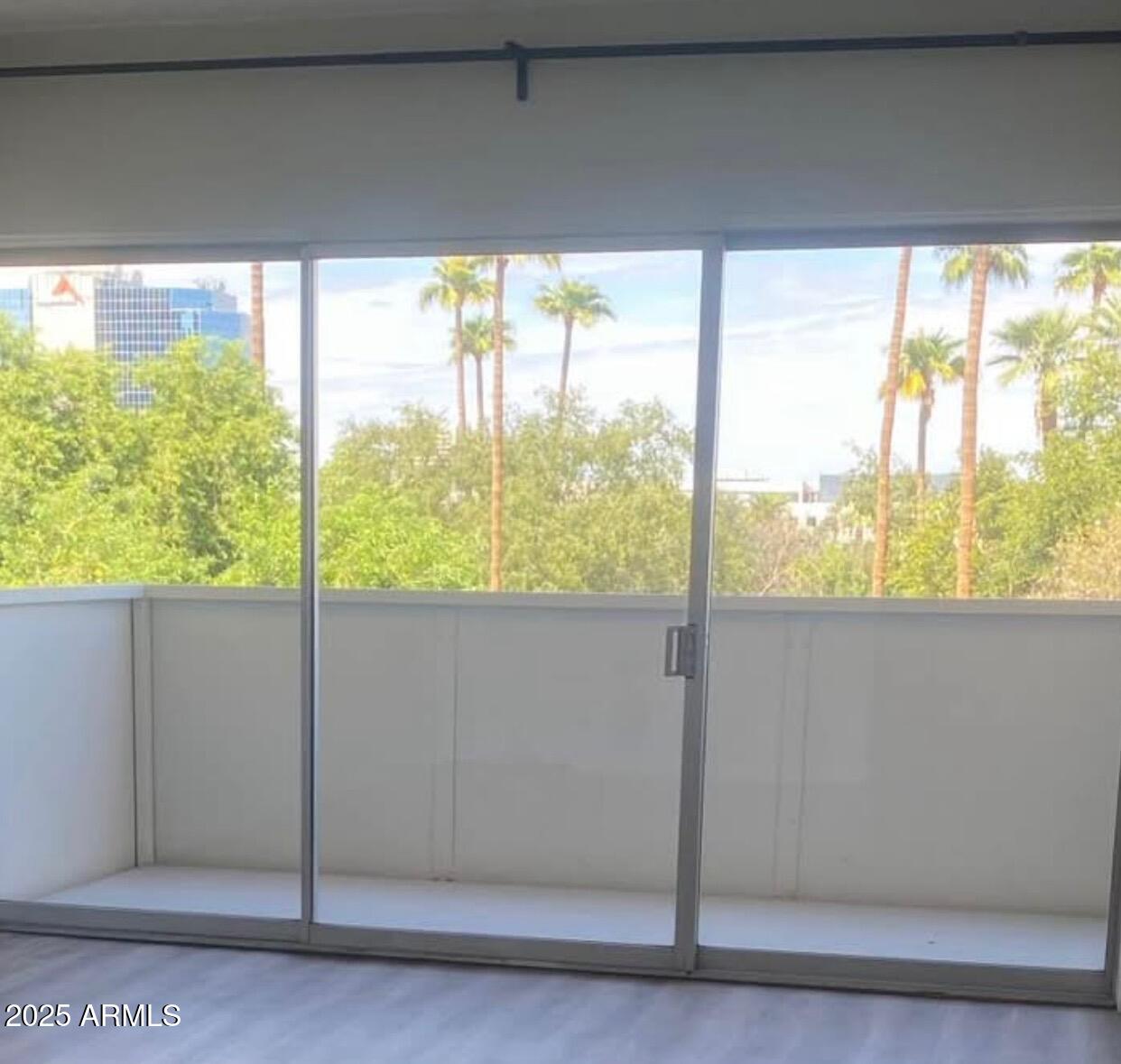 353 East Thomas Road, Unit C404 Phoenix, AZ 85004 - Photo 3 of 18 a view of a room that has a large window