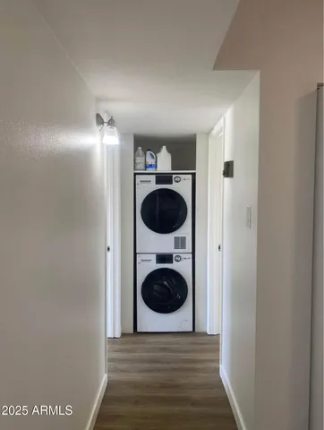 a view of a hallway with washer and dryer