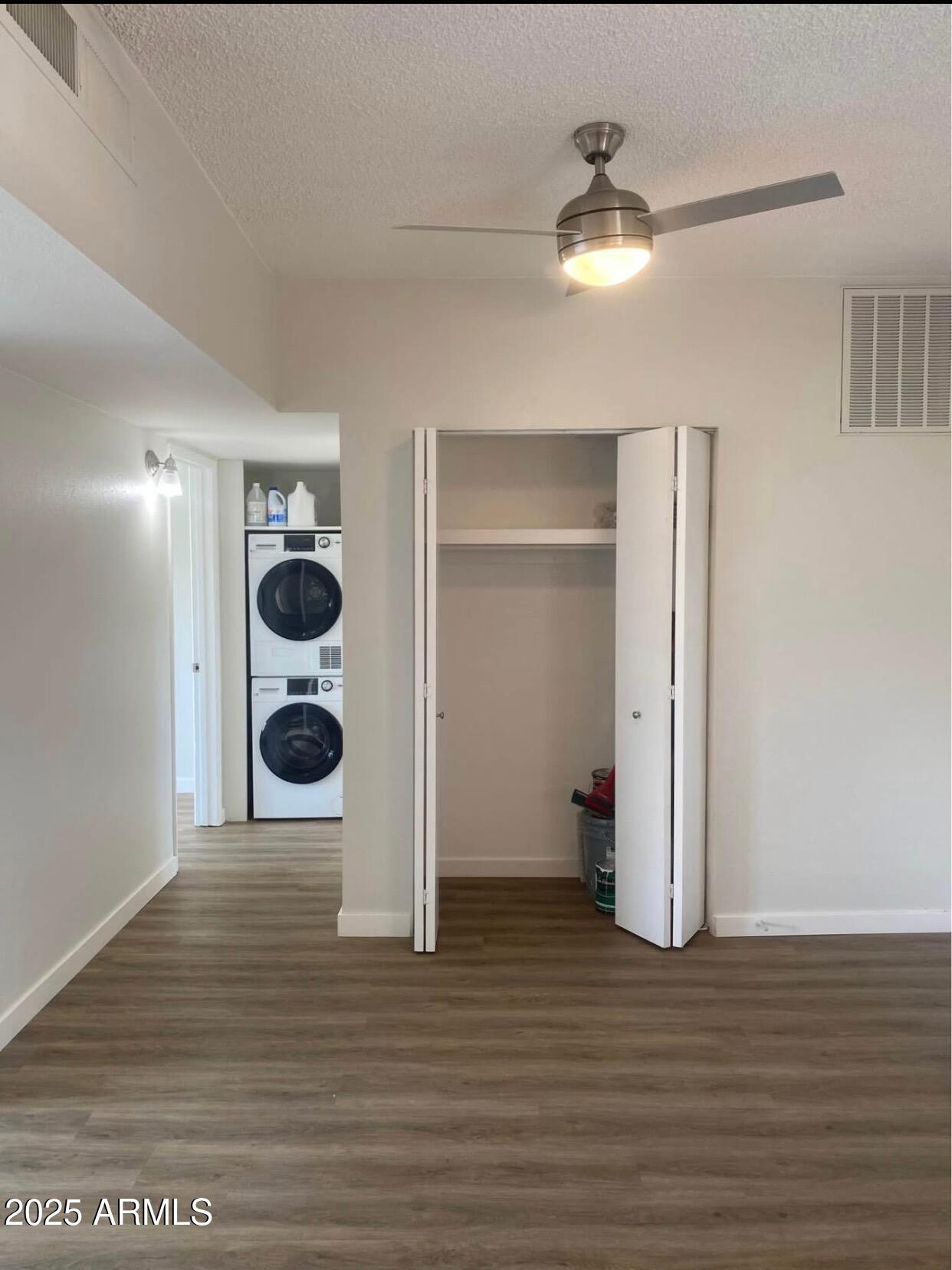 353 East Thomas Road, Unit C404 Phoenix, AZ 85004 - Photo 9 of 18 a view of a room with wooden floor and a ceiling fan