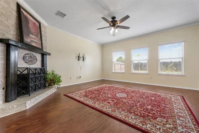 a kitchen with cabinets appliances a sink and a window
