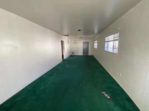 a view of an empty room and window