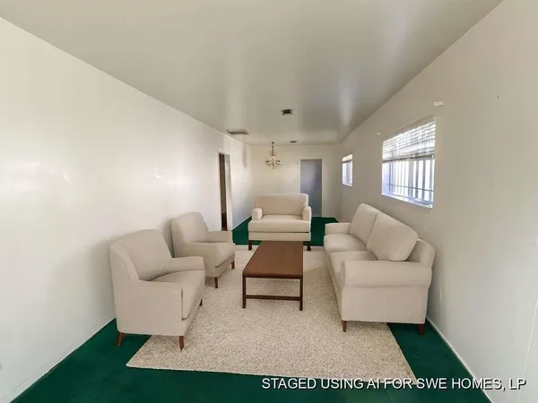 a living room with furniture and a rug
