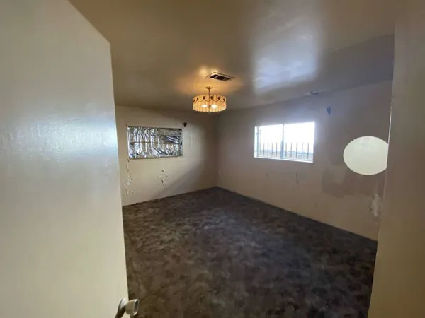 a view of an empty room and window