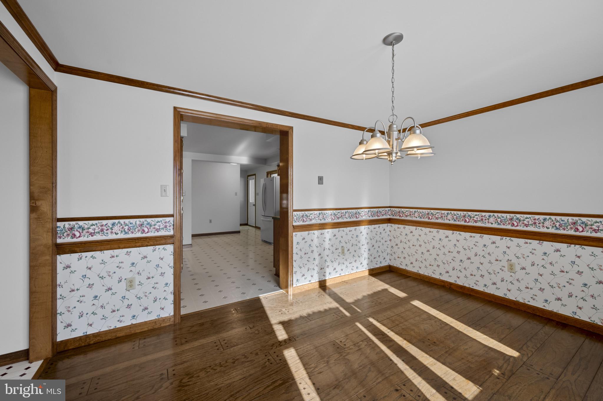 3226 Bidle Road Middletown, MD 21769 - Photo 11 of 49 a view of a hallway with wooden floor and stairs