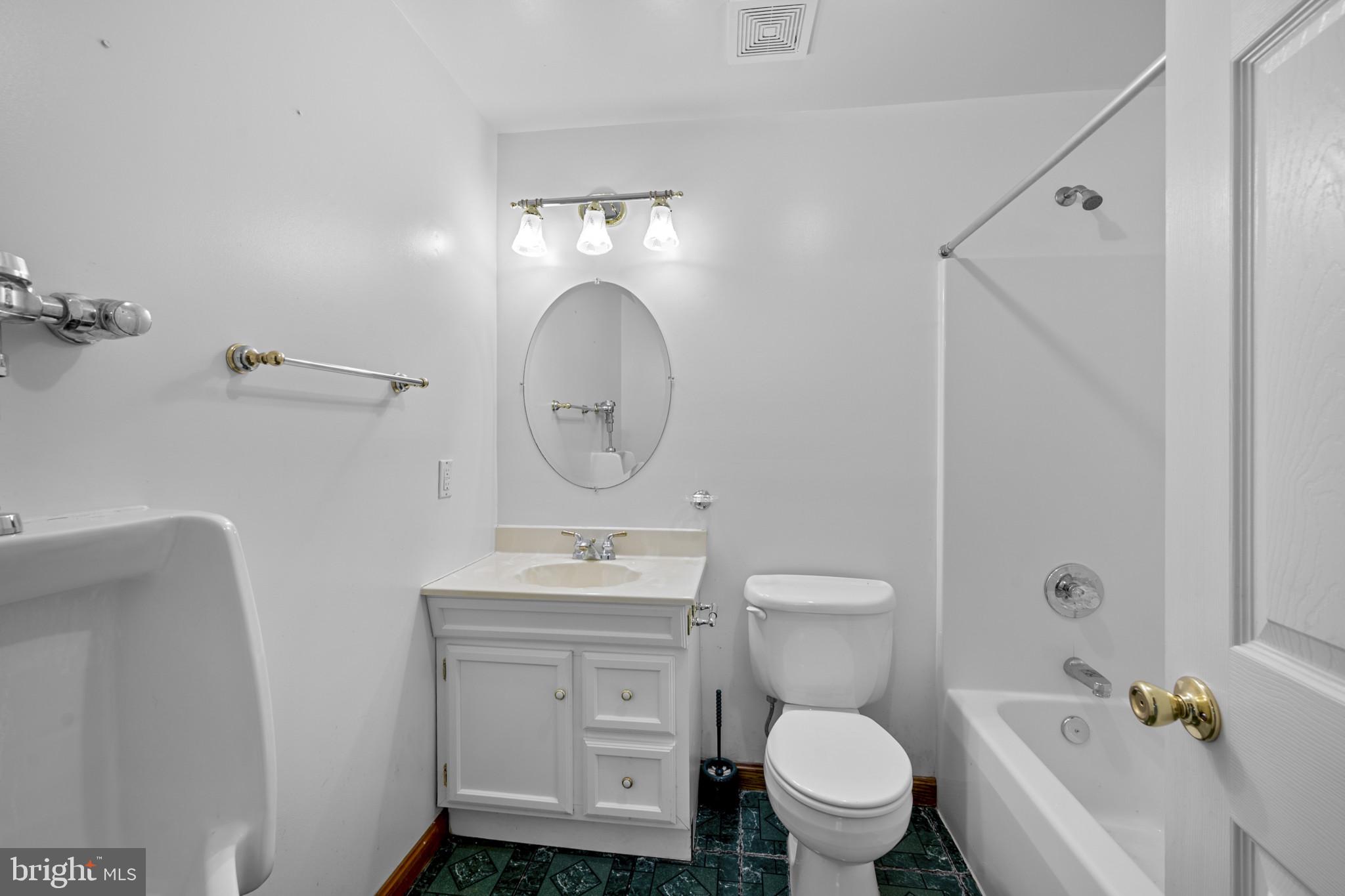 3226 Bidle Road Middletown, MD 21769 - Photo 25 of 49 a bathroom with a toilet sink vanity granite and mirror
