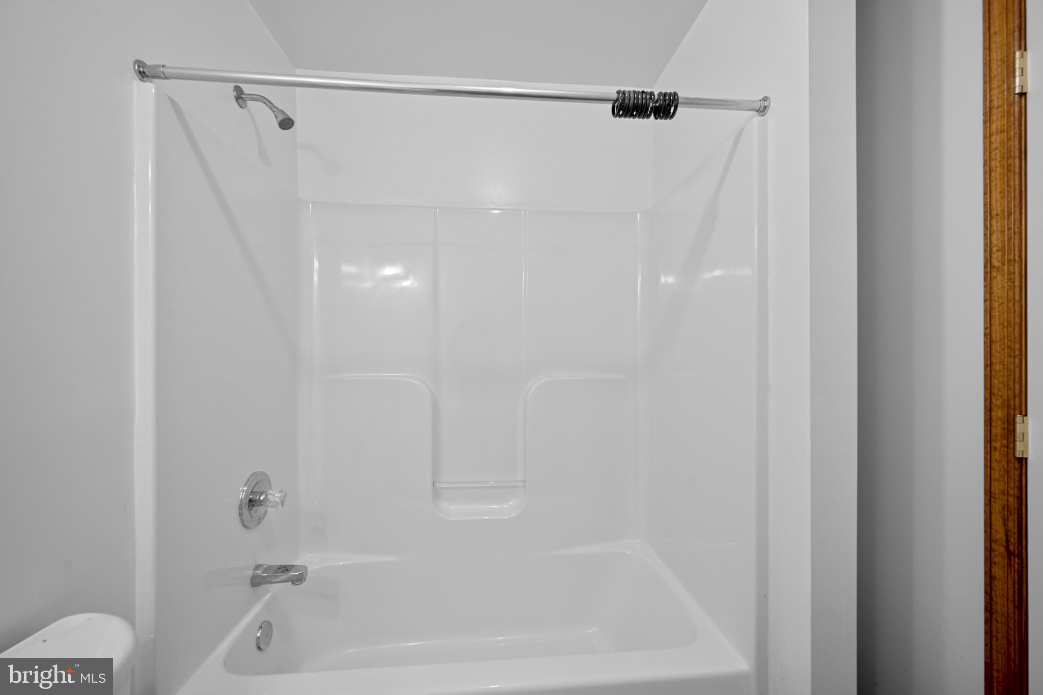 3226 Bidle Road Middletown, MD 21769 - Photo 26 of 49 a bathroom with a shower and a bath tub