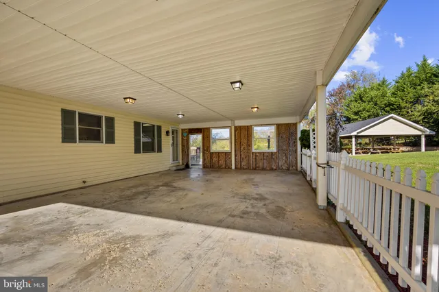 a view of a swimming pool with a lounge chair