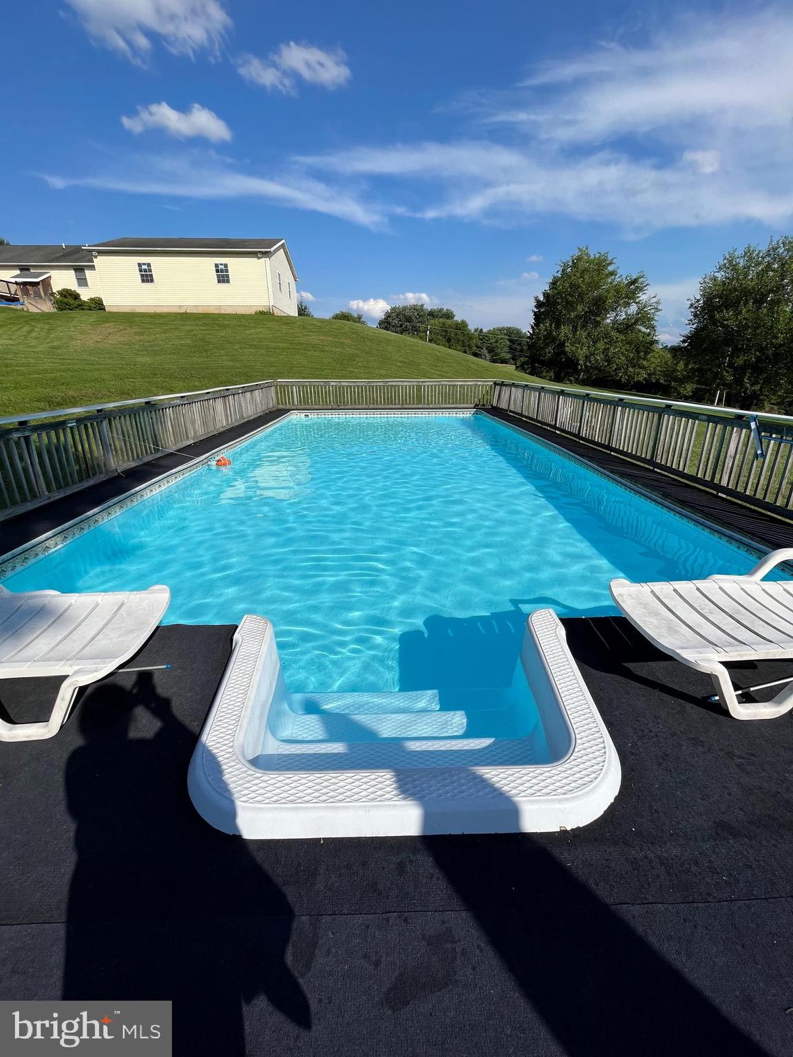 3226 Bidle Road Middletown, MD 21769 - Photo 37 of 49 a view of a swimming pool with a lounge chair