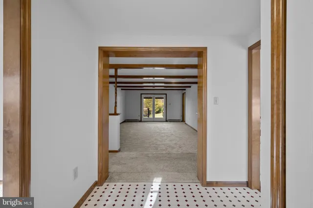 a view of a hallway to a room