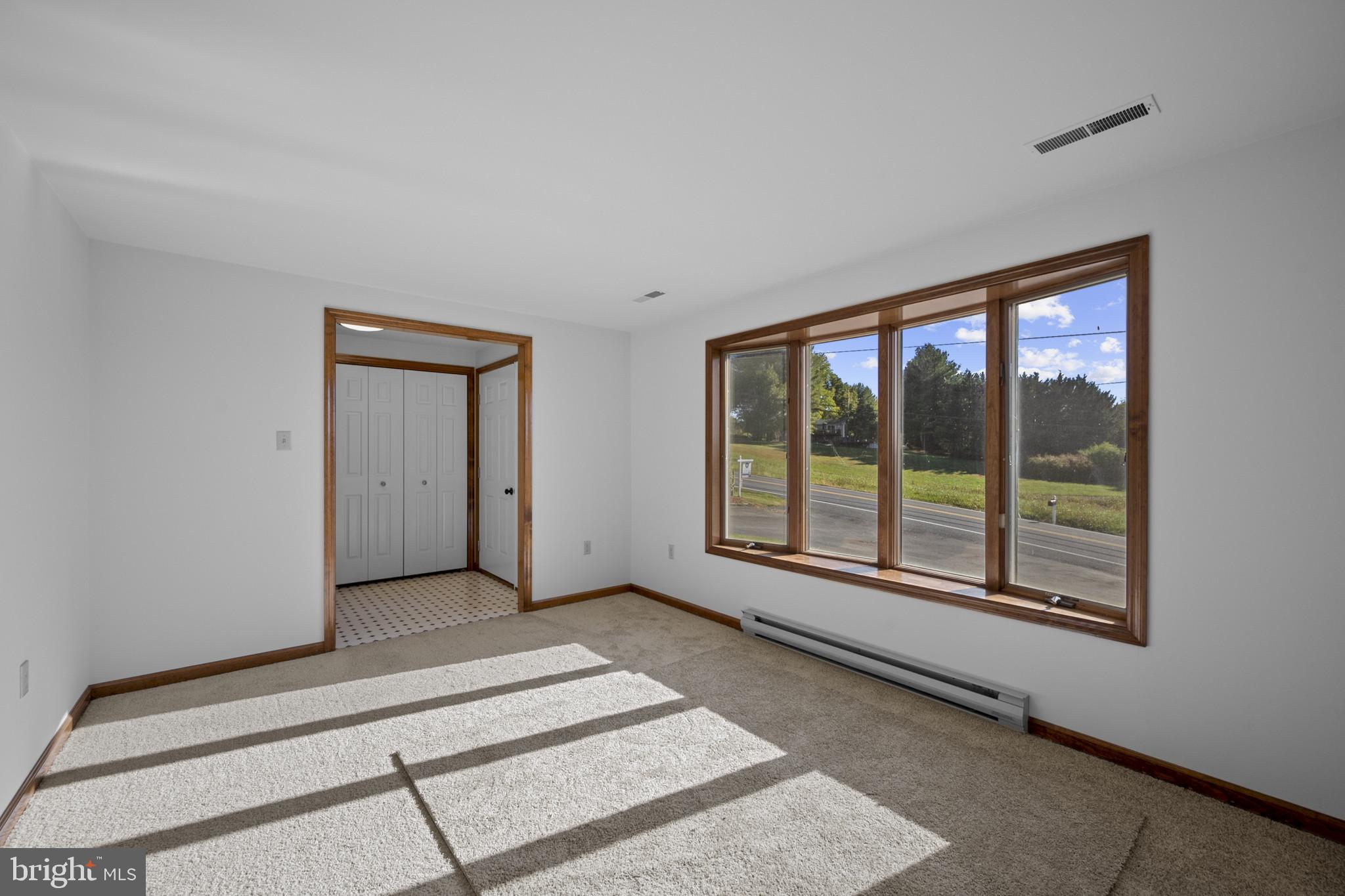 3226 Bidle Road Middletown, MD 21769 - Photo 6 of 49 a view of an empty room with a window
