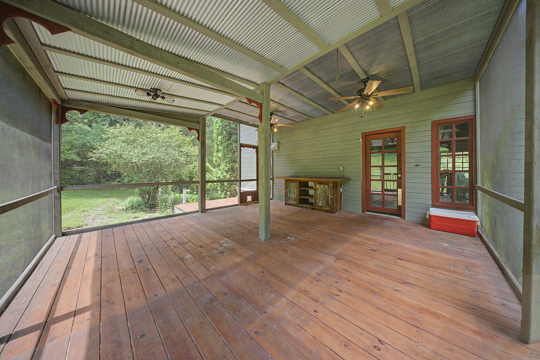 9766 Sullivan Road Union, KY 41091 - Photo 38 of 50 Access to the screened-in porch is off of the kitchen. Enjoy your morning beverage while looking for various wildlife that may pass through. In the evenings turn on some music and enjoy a relaxing evening in your new home.