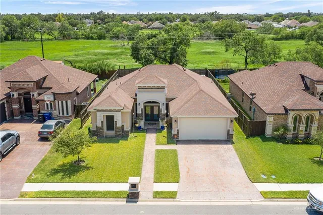 a aerial view of a house with big yard