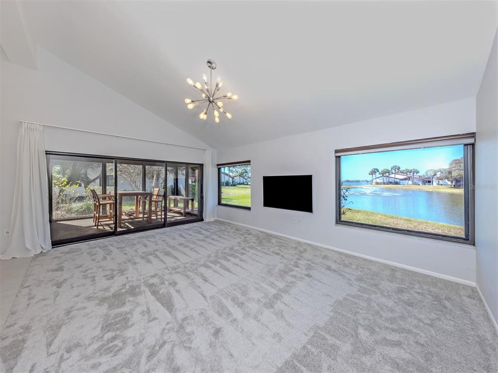 764 Sarabay Road, Unit 8 Osprey, FL 34229 - Photo 11 of 64 a view of an empty room with a window