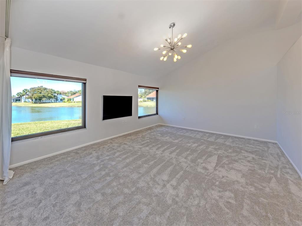 764 Sarabay Road, Unit 8 Osprey, FL 34229 - Photo 12 of 64 a view of an empty room with a window