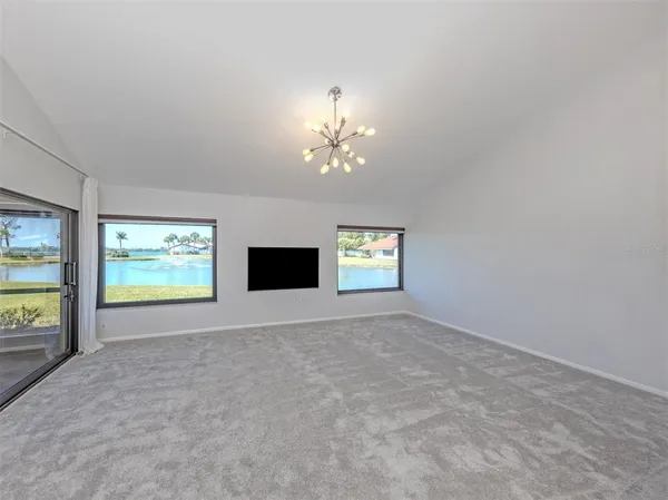 a view of a dining room with a table and chairs