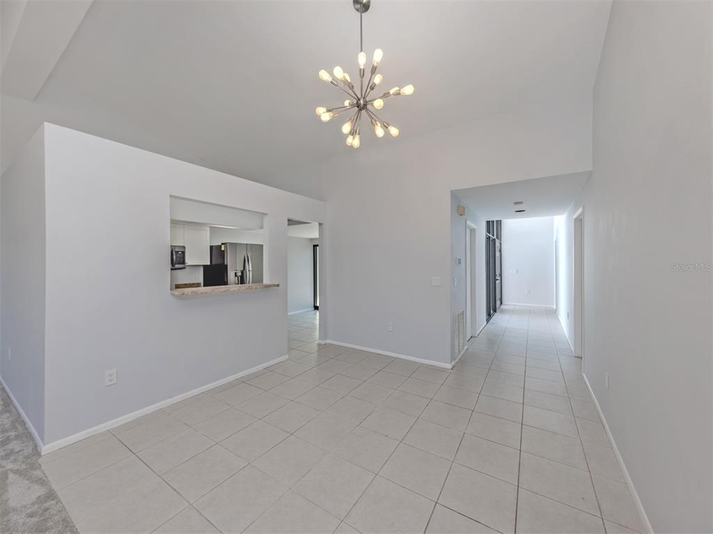 764 Sarabay Road, Unit 8 Osprey, FL 34229 - Photo 18 of 64 a view of livingroom with chandelier