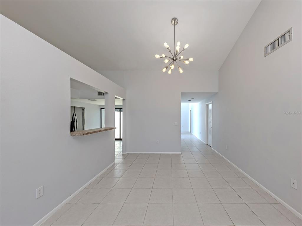 764 Sarabay Road, Unit 8 Osprey, FL 34229 - Photo 25 of 64 wooden floor in an empty room with a window