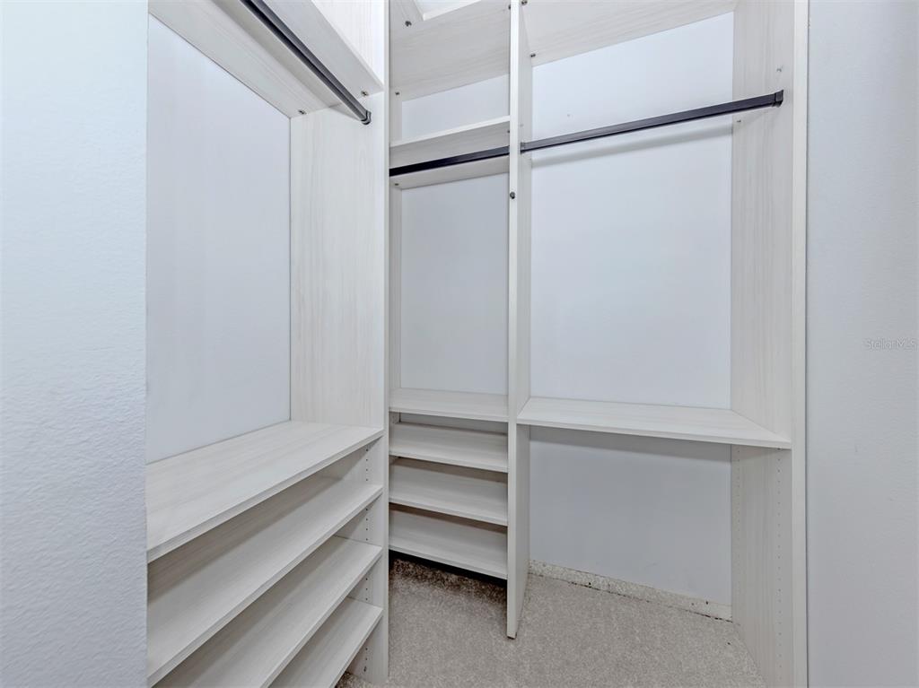 764 Sarabay Road, Unit 8 Osprey, FL 34229 - Photo 30 of 64 a view of an empty walk in closet