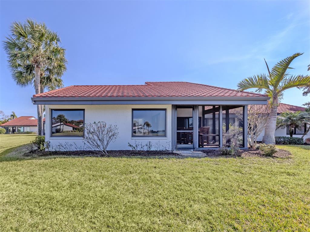 764 Sarabay Road, Unit 8 Osprey, FL 34229 - Photo 38 of 64 a front view of a house with garden