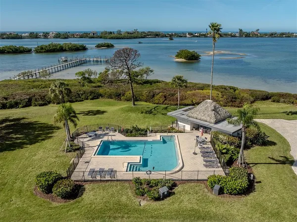 a view of a roof deck with lake view and wooden floor