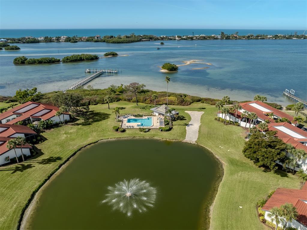 764 Sarabay Road, Unit 8 Osprey, FL 34229 - Photo 51 of 64 a view of a lake with a mountain