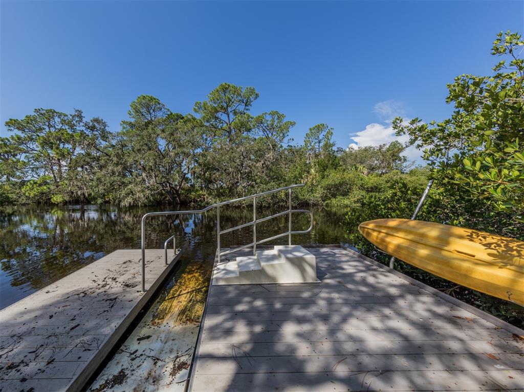 764 Sarabay Road, Unit 8 Osprey, FL 34229 - Photo 58 of 64 a view of a swimming pool with a backyard