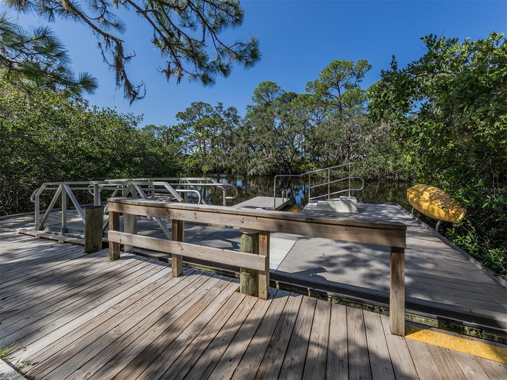 764 Sarabay Road, Unit 8 Osprey, FL 34229 - Photo 59 of 64 a view of a balcony with chairs