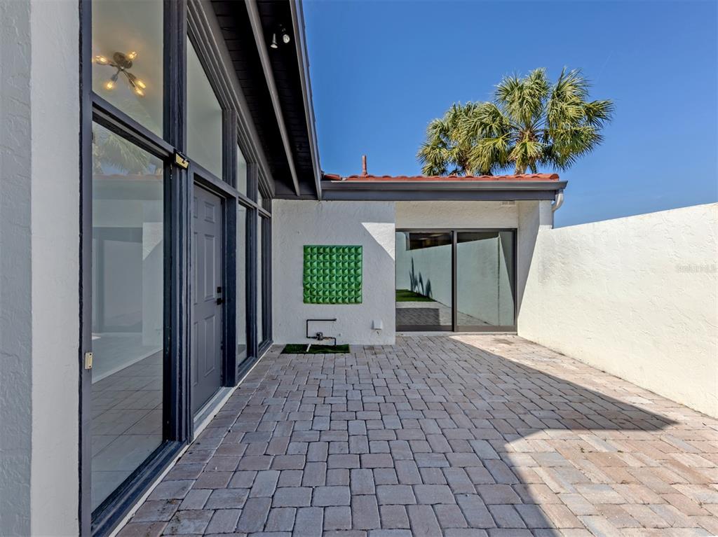 764 Sarabay Road, Unit 8 Osprey, FL 34229 - Photo 6 of 64 a porch with seating space