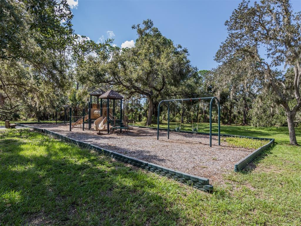 764 Sarabay Road, Unit 8 Osprey, FL 34229 - Photo 63 of 64 a view of a park with large trees