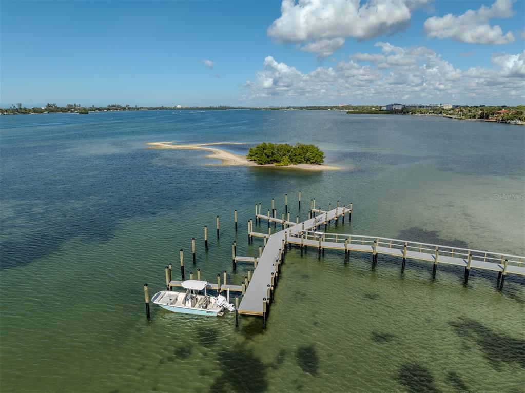 764 Sarabay Road, Unit 8 Osprey, FL 34229 - Photo 8 of 64 a view of a lake with outdoor space