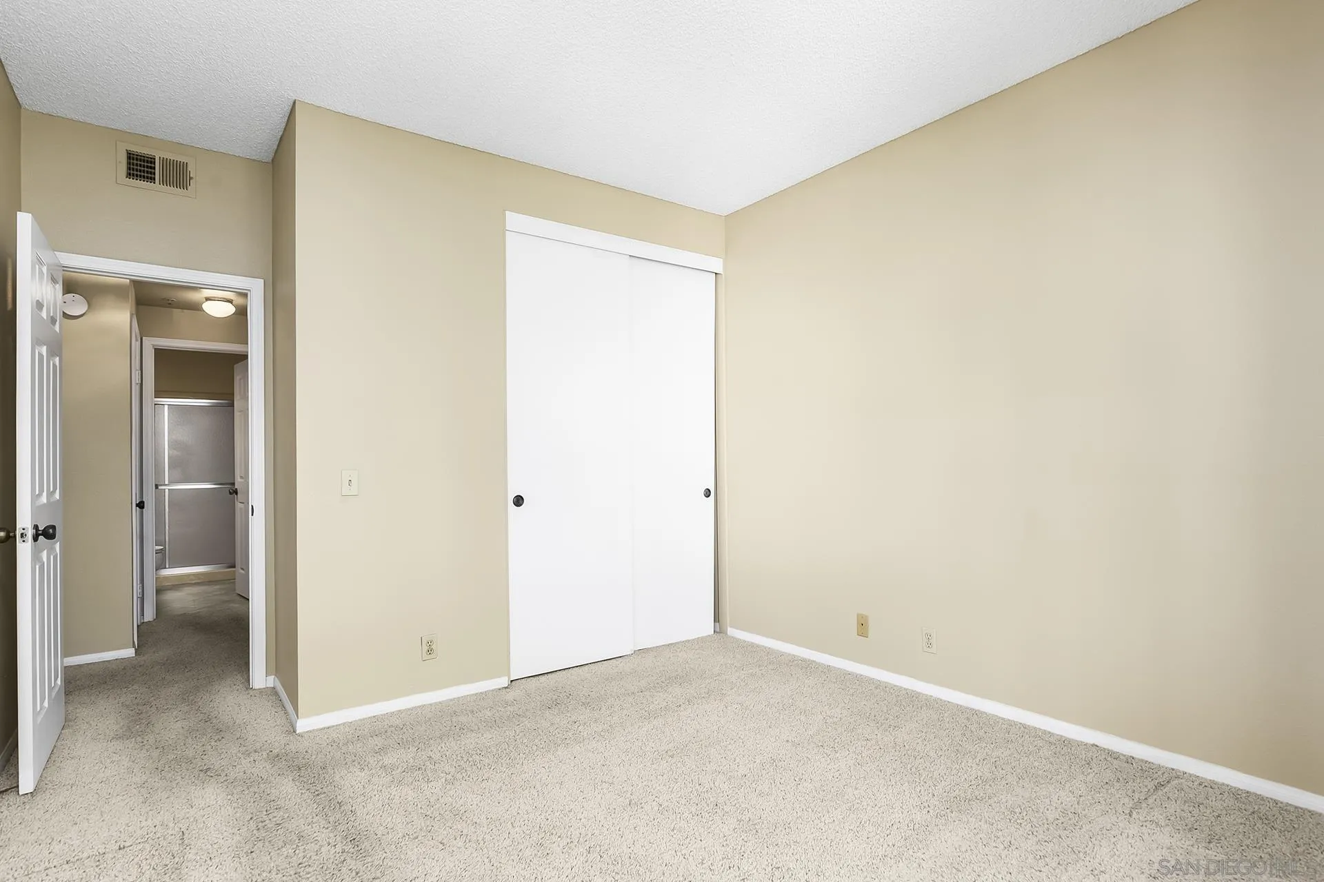 5875 Friars Road, Unit 4307 San Diego, CA 92110 - Photo 13 of 26 a view of an empty room with closet and a window