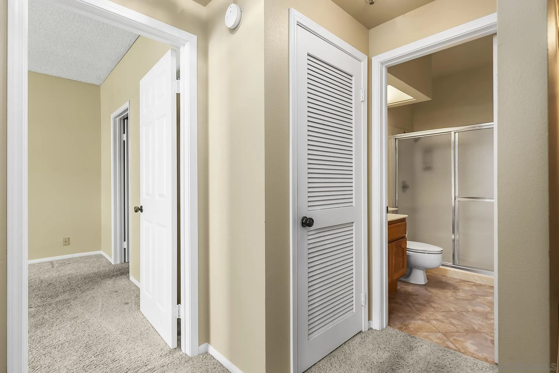 5875 Friars Road, Unit 4307 San Diego, CA 92110 - Photo 15 of 26 a view of a bathroom with a toilet and a view of bathroom