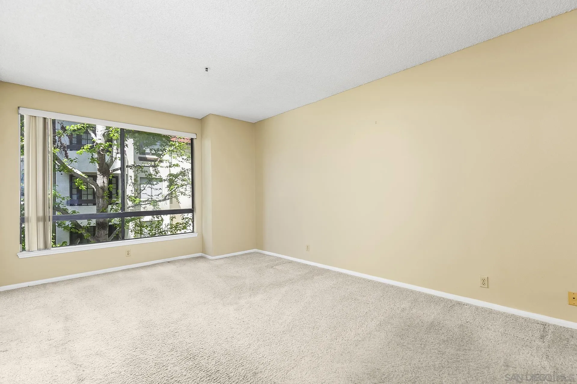 5875 Friars Road, Unit 4307 San Diego, CA 92110 - Photo 16 of 26 a view of an empty room with a window