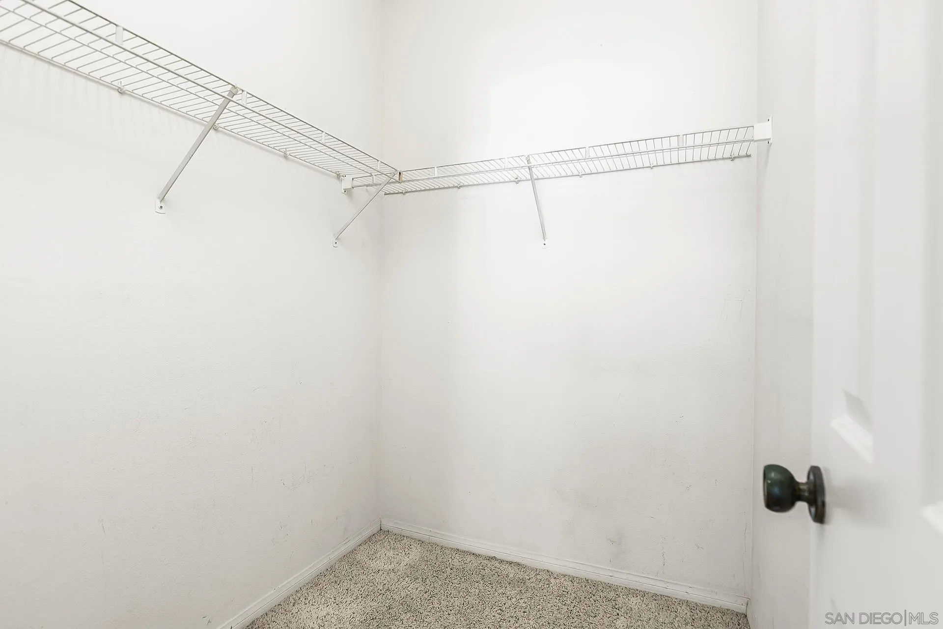 5875 Friars Road, Unit 4307 San Diego, CA 92110 - Photo 19 of 26 a view of a room with racks on the wall