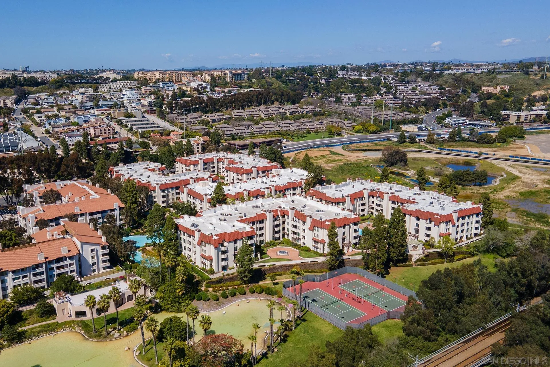 5875 Friars Road, Unit 4307 San Diego, CA 92110 - Photo 24 of 26 an aerial view of residential houses with outdoor space and lake view