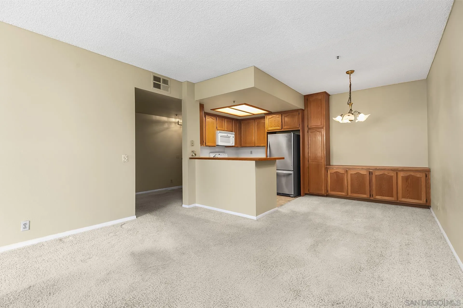 5875 Friars Road, Unit 4307 San Diego, CA 92110 - Photo 8 of 26 a view of a kitchen with a sink