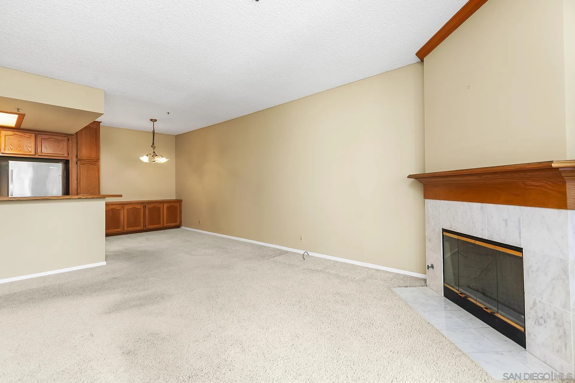 5875 Friars Road, Unit 4307 San Diego, CA 92110 - Photo 9 of 26 a view of an empty room and fire place