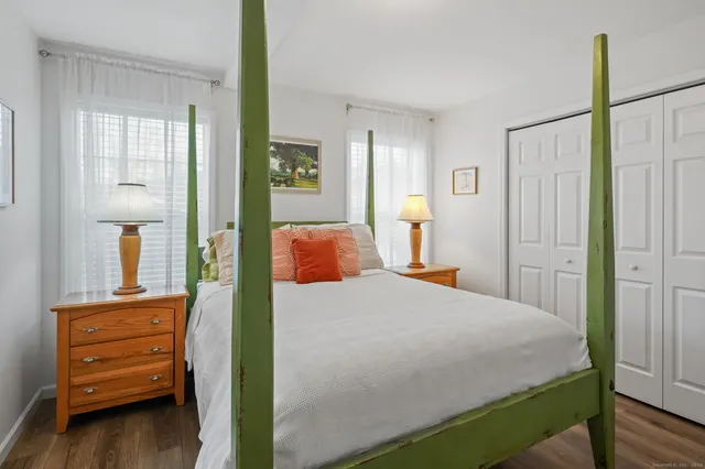 a bedroom with a bed and a view of bathroom
