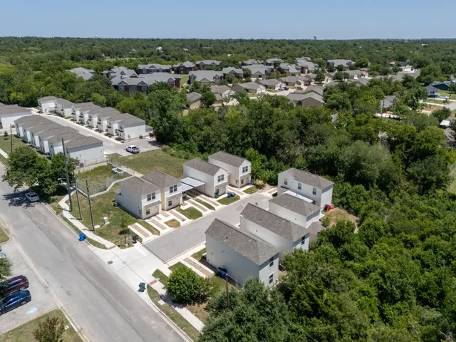 an aerial view of a house with a garden