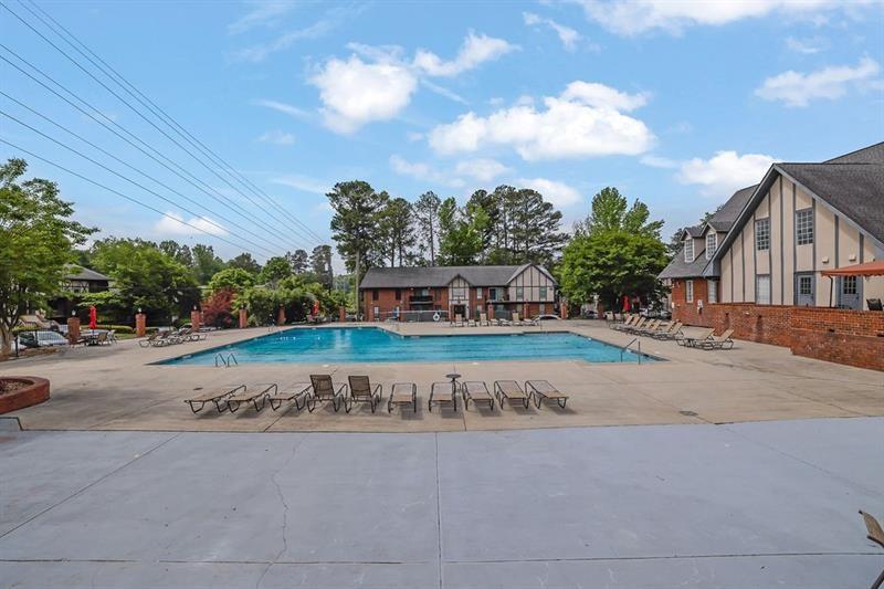 6851 Roswell Road, Unit C7 Atlanta, GA 30328 - Photo 28 of 28 a wooden bench sitting in front of a building