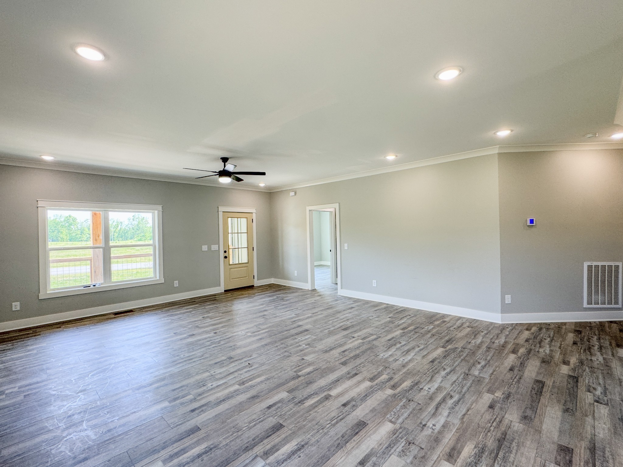 181 Rock House Hollow Road Bethpage, TN 37022 - Photo 16 of 51 an empty room with wooden floor and windows