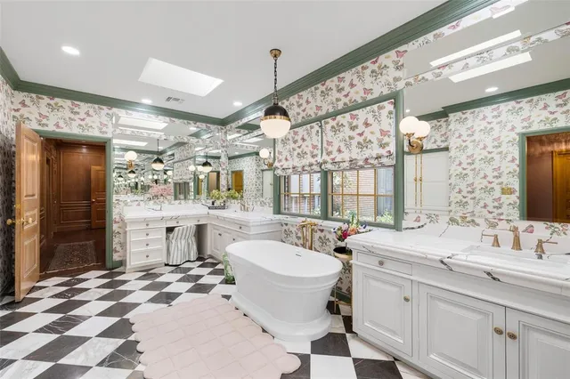 a bathroom with a sink double vanity and a mirror