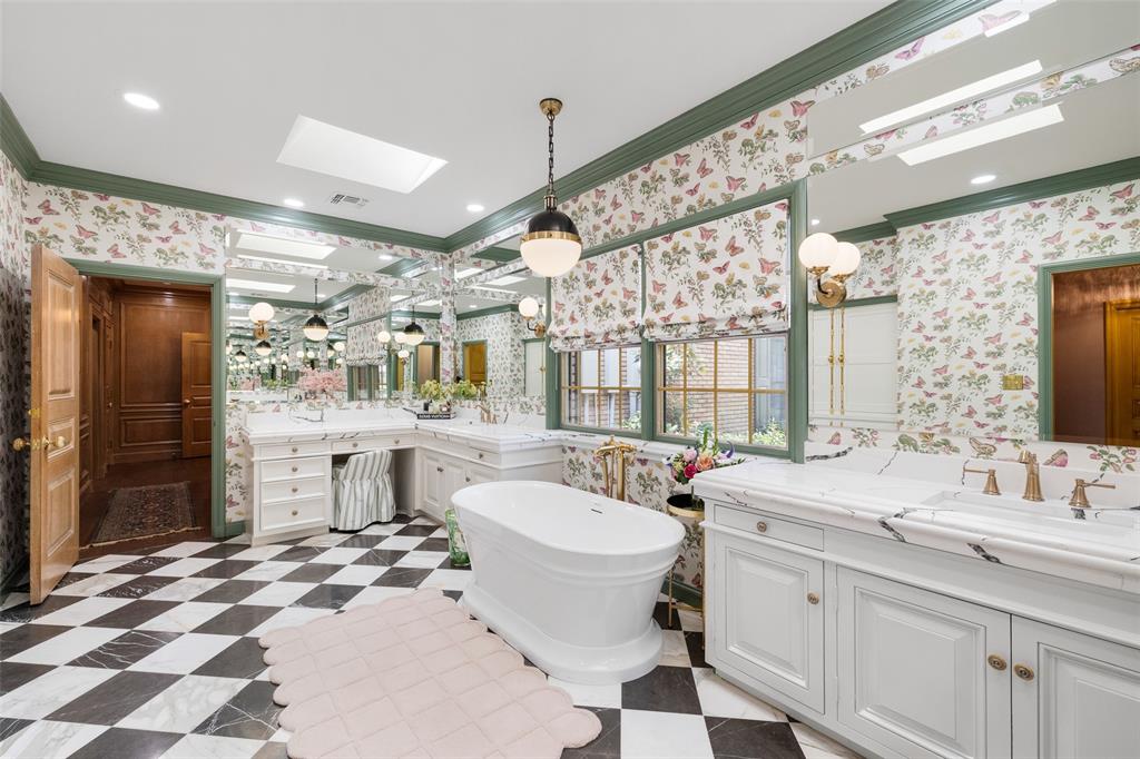 924 Kintner Drive Graham, TX 76450 - Photo 15 of 40 a bathroom with a sink double vanity and a mirror