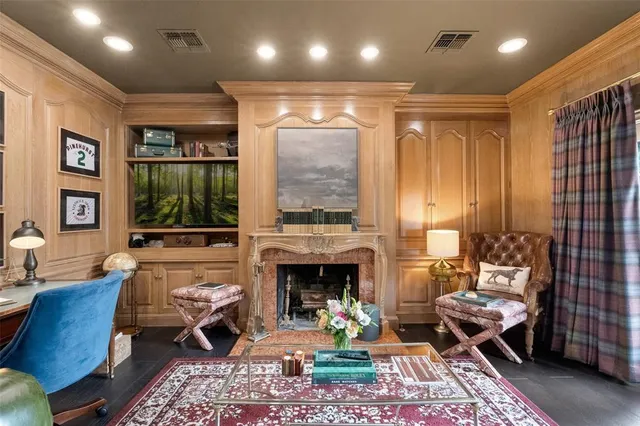 a living room with furniture and a fireplace