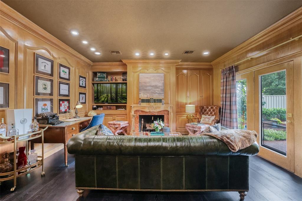 924 Kintner Drive Graham, TX 76450 - Photo 21 of 40 a living room with furniture a fireplace and a floor to ceiling window