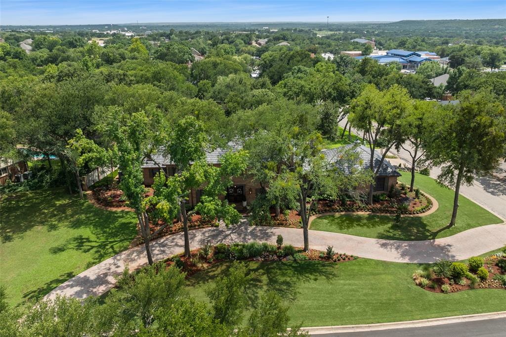 924 Kintner Drive Graham, TX 76450 - Photo 3 of 40 a view of a forest with a yard
