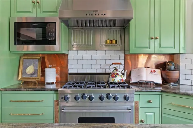 a kitchen with a stove and cabinets