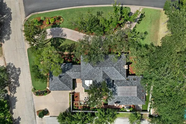an aerial view of a house with a yard and garden