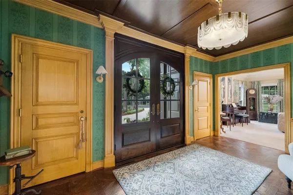a view of a room with furniture and wooden floor